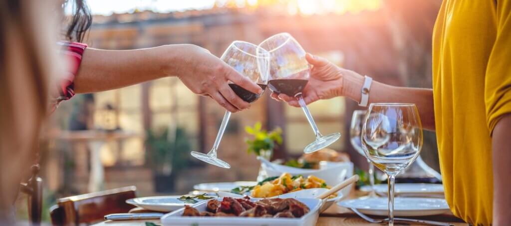 Enjoy Serbia - friends toasting red wine